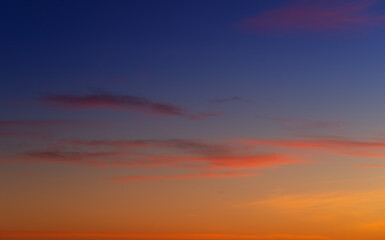 Sunset sky with pink and gray clouds