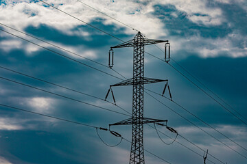 electric pole and wires against the sky