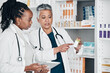 Pharmacy, inventory and women on digital tablet for prescription, label and information check. Pharmacist, colleagues and ladies online, internet and search while doing stock at a clinic dispensary