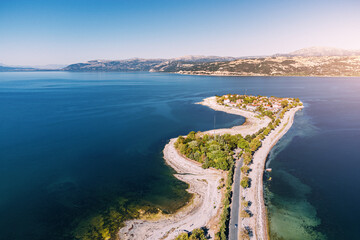 Wall Mural - Aerial scenic view of Egirdir lake peninsula and town in Isparta region. Calm turquoise and scenic coast of national park in Turkey