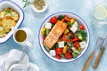Wall Mural - Greek salad with grilled salmon fish. Traditional mediterranean cuisine. Healthy food, diet. Top view