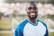 Sports, football and portrait of black man with smile on field and motivation for winning game in Africa. Confident, proud and face of happy professional soccer player at exercise or training match.