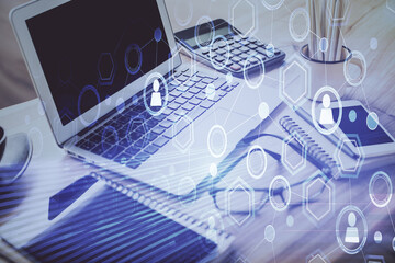 Poster - Computer on desktop with social network hologram. Double exposure. Concept of international people connections.