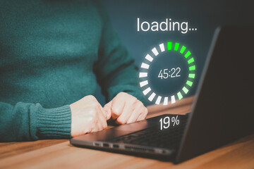 Poster - Adult man using a laptop computer for download software and waiting to loading digital business data form website, very slow internet form wifi. Concept of waiting for load of loading symbol.