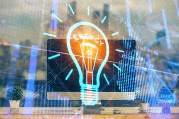Poster - Computer on desktop in office with bulb icon hologram. Multi exposure. Concept of idea.