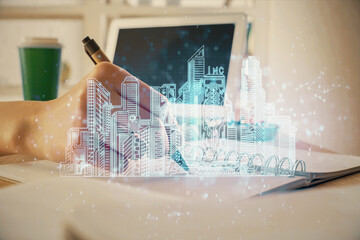 Poster - IOT drawing over writing hands in notepad background. Concept of smart home. Multi exposure