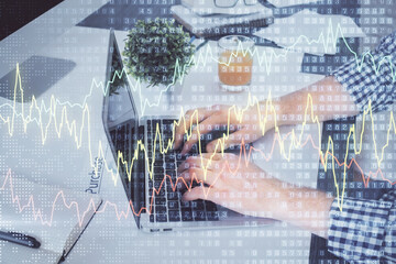Poster - Double exposure of graph with man typing on computer in office on background. Concept of hard work.