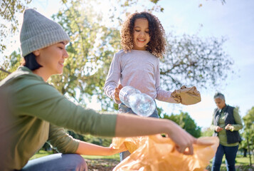 Recycle plastic, bottle and people with child in park for community service, volunteering and cleaning education. Happy woman with kid in nature forest for recycling, pollution and earth day support