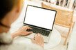 © panitan - computer screen blank mockup.hand woman work using laptop with white background for advertising,contact business search information on desk at coffee shop.marketing and creative design