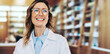© Jacob Lund - Healthcare worker standing in a pharmacy
