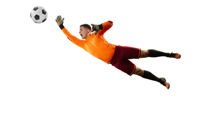 Young man, soccer football goalkeeper catches ball in jump isolated over white background. Concept of sport, action, motion, goals.