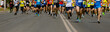 © sports photos - large group of leg runners athletes run urban marathon