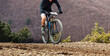 male cyclist biking mountain bike on trail race