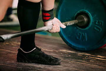 Wall Mural - close-up athlete and barbell exercise deadlift