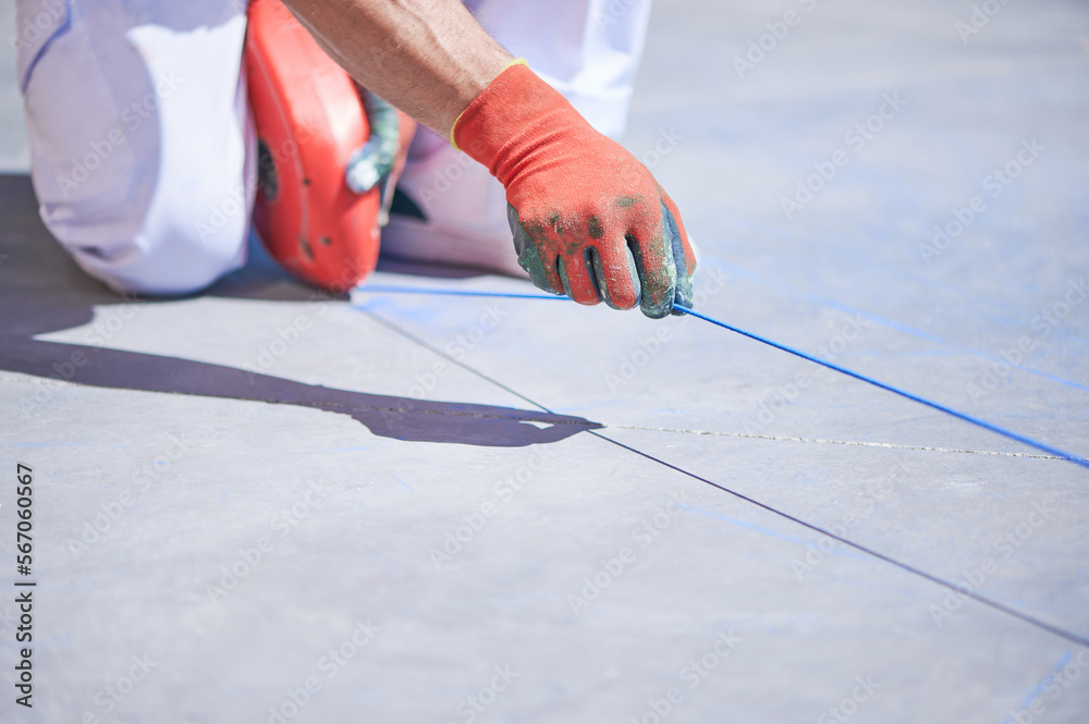 Marking Rope With Powder Professional painter at work. Unrecognizable young man uses a rope ...