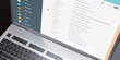 © Rawf8 - Client mail list on computer laptop screen closeup above view. Email message communication.