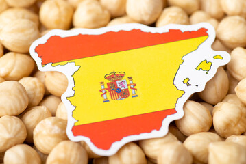 Wall Mural - Flag and map of Spain on hazelnuts. Concept of growing hazelnuts in Spain, agribusiness