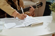© DragonImages - Closeup image of girl practicing exercise for her acoustic guitar class