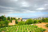 Fototapeta Miasto - Orchards and gardens of the Generalife with the Alhambra and the city of Granada in the background, Andalusia, Spain. World Heritage by unesco