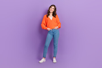 Poster - Full body photo of attractive gorgeous lady wear stylish outfit hands pockets look empty space advertisement isolated on purple color background