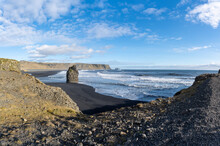 Dyrhólaey (Dyrholaey, Door Hill Island, Cape Portland), Small Promontory Located On South Coast Of Iceland, Near Vik. Reynisfjara And Reynisdrangar As Seen From Dyrhólaey. Arnardrangur "Eagle Rock"