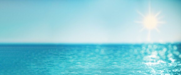 Wall Mural - Defocused blue sea landscape background with sunny bokeh 