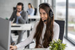 © Bojan - Portrait of young beautiful woman with headset working at call center in modern office.