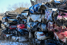Junk Cars Stacked Up At Auto Parts Salvage Yard In The Winter