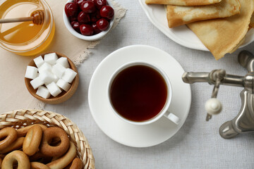 Wall Mural - Cup of aromatic tea and treats on table, flat lay