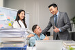 © Kawee - Asian young businessman patient work with manager in office workplace.