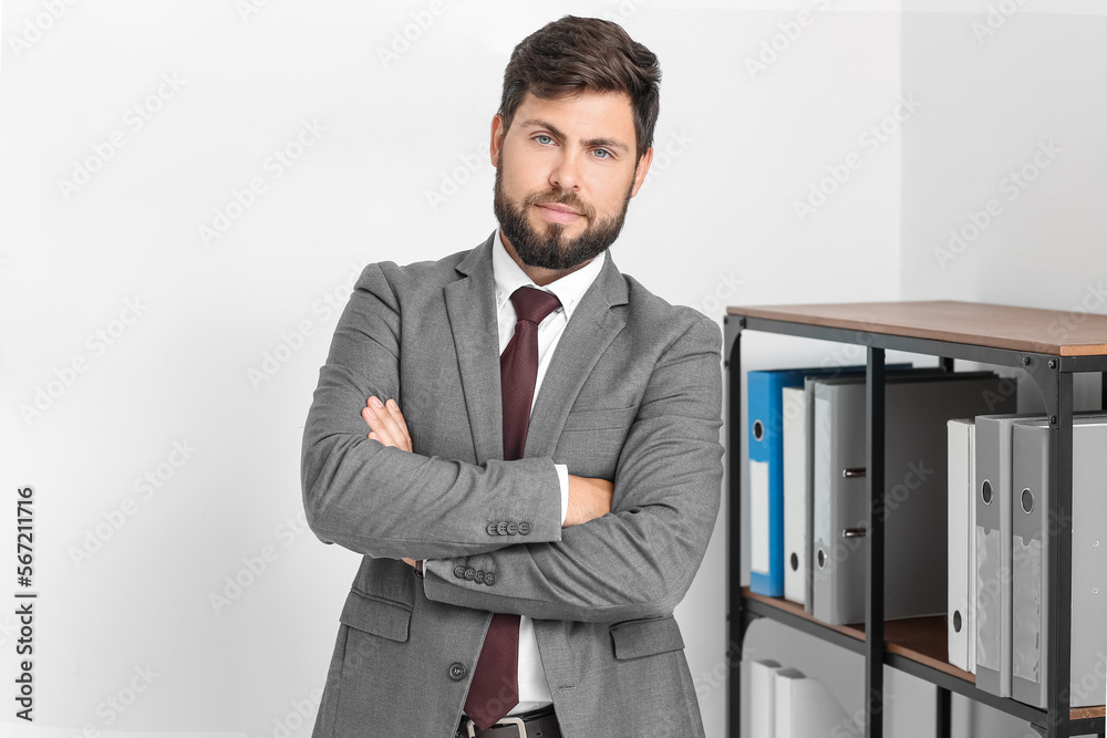 Handsome young businessman in office