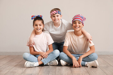 Poster - Happy little friends sitting near grey wall