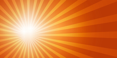 Bright sun on the left side of the sky with sun rays and lens flares in a bright orange sky.