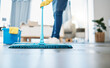 © Lou W/peopleimages.com - Housekeeping, cleaning and woman maid with a mop to clean the living room floor at a house. Female domestic worker, cleaner and housewife washing the ground for bacteria, dust or dirt in her home.