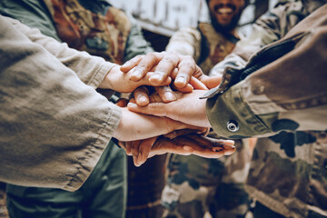 Soldier, team building or hands in a huddle for a mission, strategy or motivation on a paintball battlefield. Goals, collaboration or army people with support in a partnership or military group