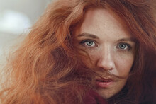 Redhead Young Woman With Green Eyes And Freckles