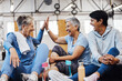 © S Fanti/peopleimages.com - Gym, high five and group of mature women celebrate after fitness class, conversation and congratulations on floor. Exercise, bonding and happy senior woman with friends sitting together at workout.
