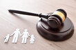 Family and minor judicial protection concept with gavel elevated