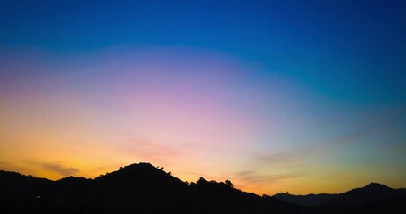 Wall Mural - Sunrise dawn morning mountain timelapse with rising sun, sunset sky 4k clip