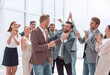 © ASDF - happy young business man accepting congratulations from his colleagues.