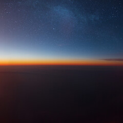 Poster - amazing sunset in the sky with stars and clouds. photo from the plane. travel and flight concept
