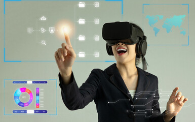 Poster - Metaverse technology concept. Asian businesswoman wearing vr headset watching, touching on virtual reality world icon, connecting and control online network and strategy.
