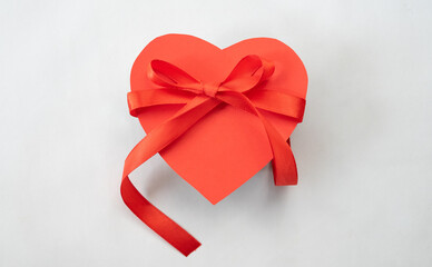 Poster - Heart gift box with red ribbon tie. Love shape design element