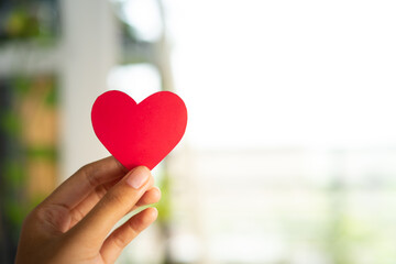 Poster - Hands holding heart with minimalist interior background