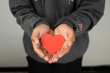 Poster - a boy holding heart shape for valentine background