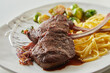 © exclusive-design - Grilled deer steaks with spaghetti