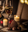 © Marcio - Uma exótica coxinha ( típica comida brasileira ) de chocolate, lindos bombons com detalhes dourados, em um jantar especial de dia dos namorados ou data especial, com iluminação a luz de velas