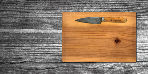 Wall Mural - Topview of Cooking Knife and Cutting Board on Dark Background