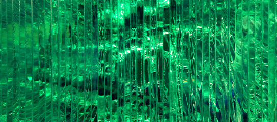 sheets of transparent green glass closeup view, with precious shiny crystal texture effect - abstract photo viridian pattern for a wallpaper background with a futuristic look of matrix