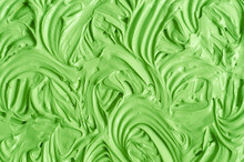 Green Cosmetic Clay (cucumber Facial Mask, Avocado Face Cream, Green Tea Matcha Body Wrap) Texture Close Up, Selective Focus. Abstract Background With Swirl Brush Strokes.